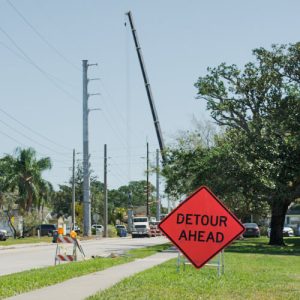 Traffic control reroutes drivers away from crane operation